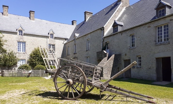 Cart in front of a farm